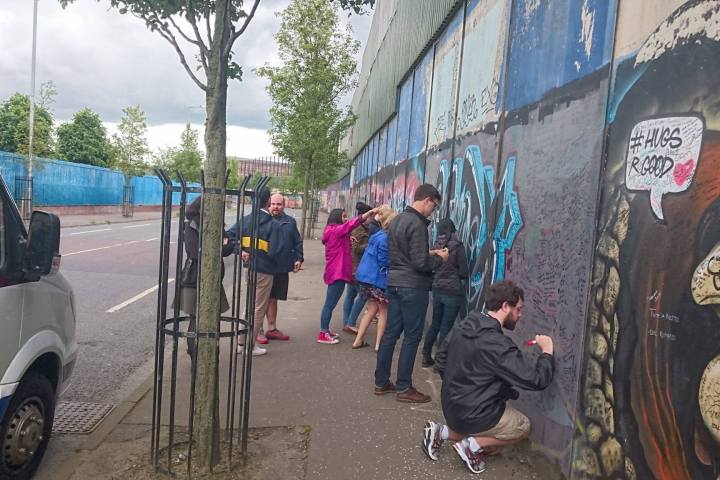 signing the peace wall in Belfast Ireland
