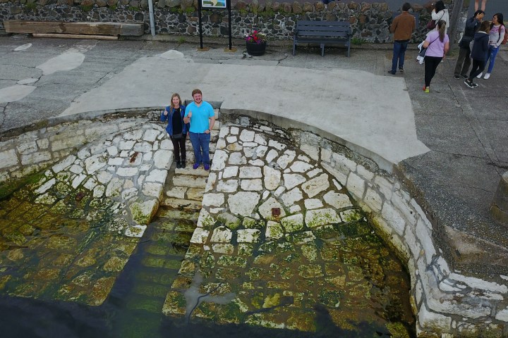 A group showing their thumbs up