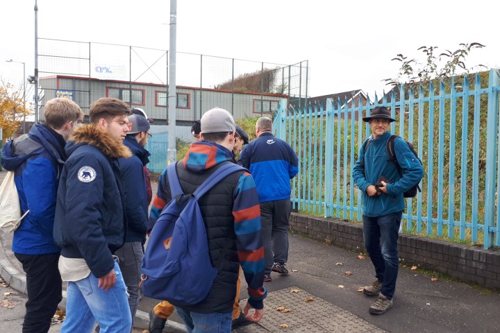 A group of people walking about in Belfast