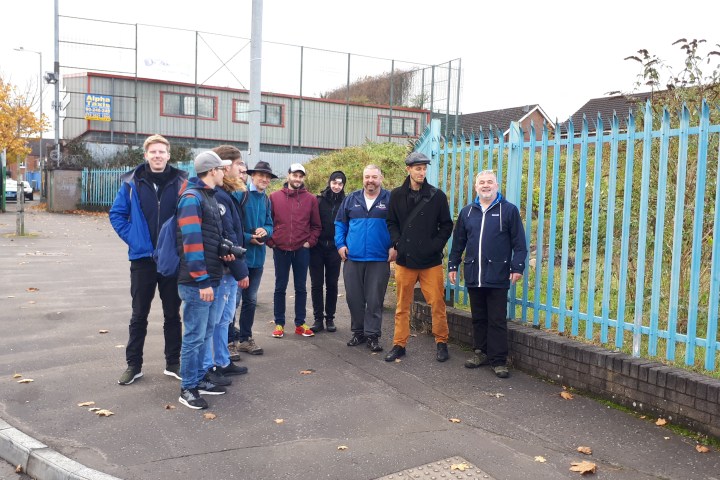 a walking tour of Belfast with people smiling